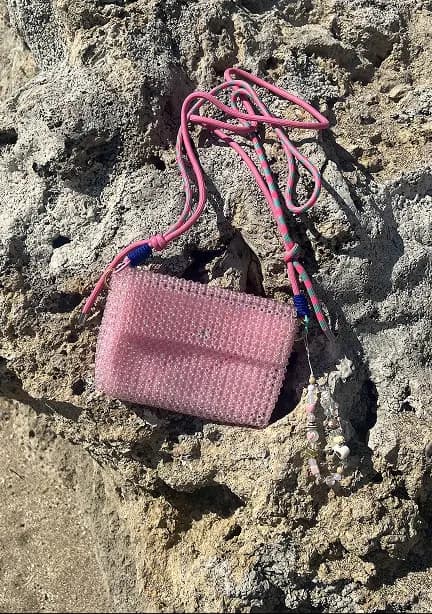 Beaded bag on rock